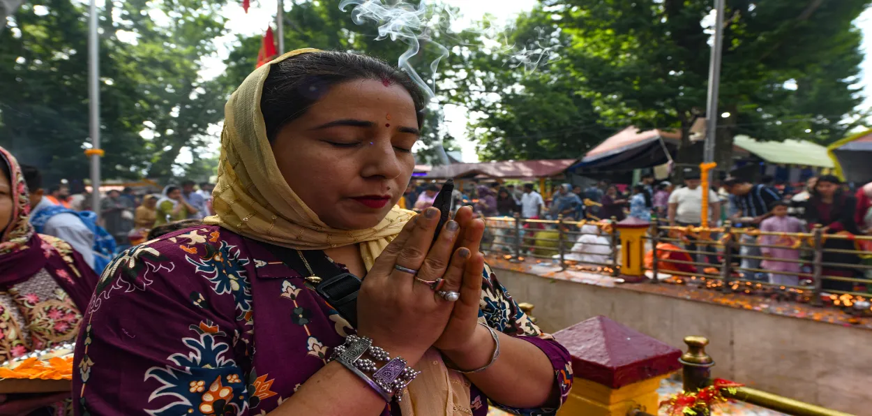 A woman praying at Kheer Bhawani temple (All pics Basit Zargar)