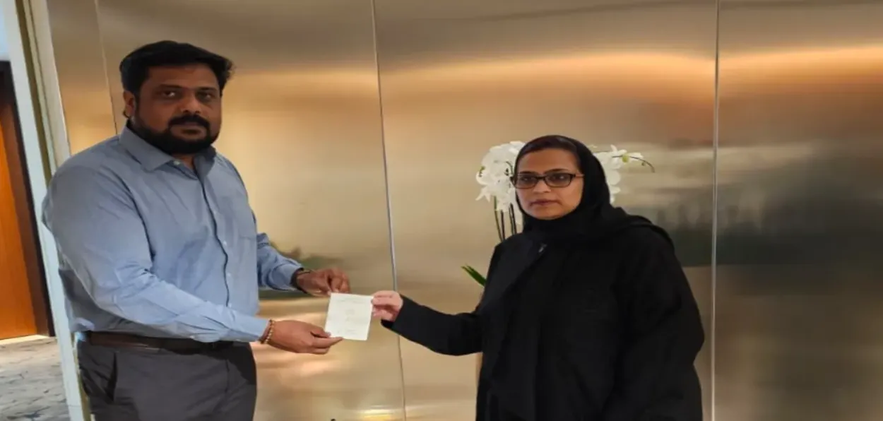 Nazneen with Indian embassy official received her papers to travel