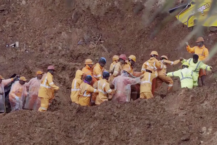 Rescue teams continue search operation at Wayanad landslide site.