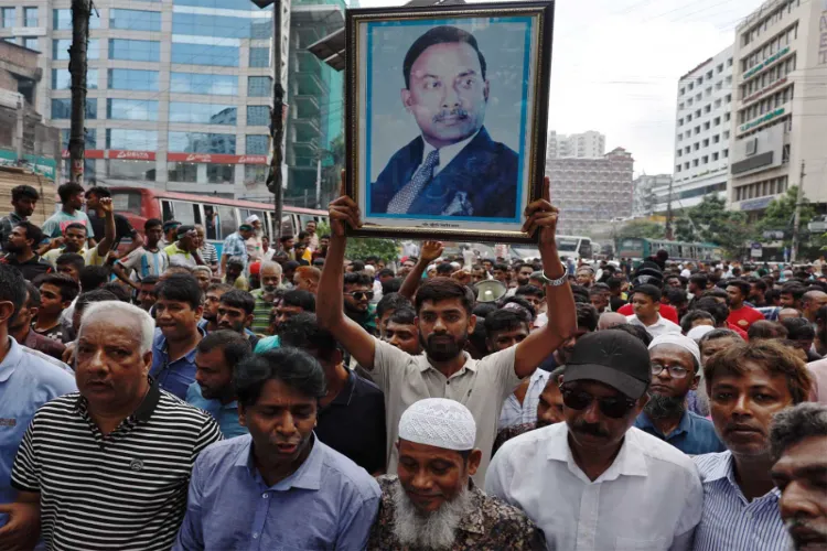 Supporter of Bangladesh Nationalist Party (BNP) holds a picture of former President Ziaur Rahman 