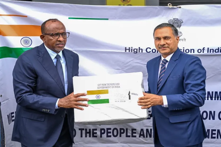 High Commissioner Adarsh Swaika hands over consignment to Kenya's Cabinet Secretary for Health, Aden Duale, at Jomo Kenyatta International Airport (JKIA), Nairobi