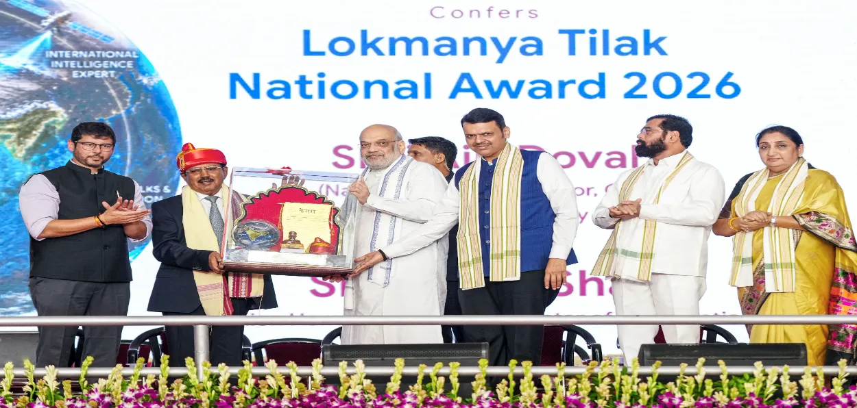 Union Home Minister Amit Shah conferring the 'Lokmanya Tilak National Award 2026' upon NSA Ajit Doval 