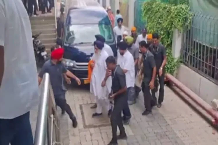 Akali Dal chief and former Punjab deputy chief minister Sukhbir Singh Badal is seen walking inside a building with a cloth wrapped around his right hand after he was attacked near a gurudwara, in Nanded district, Maharashtra