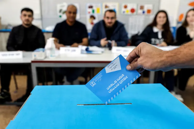 An Israeli man casts his vote at a polling station in Rahat during Israel's general election. 