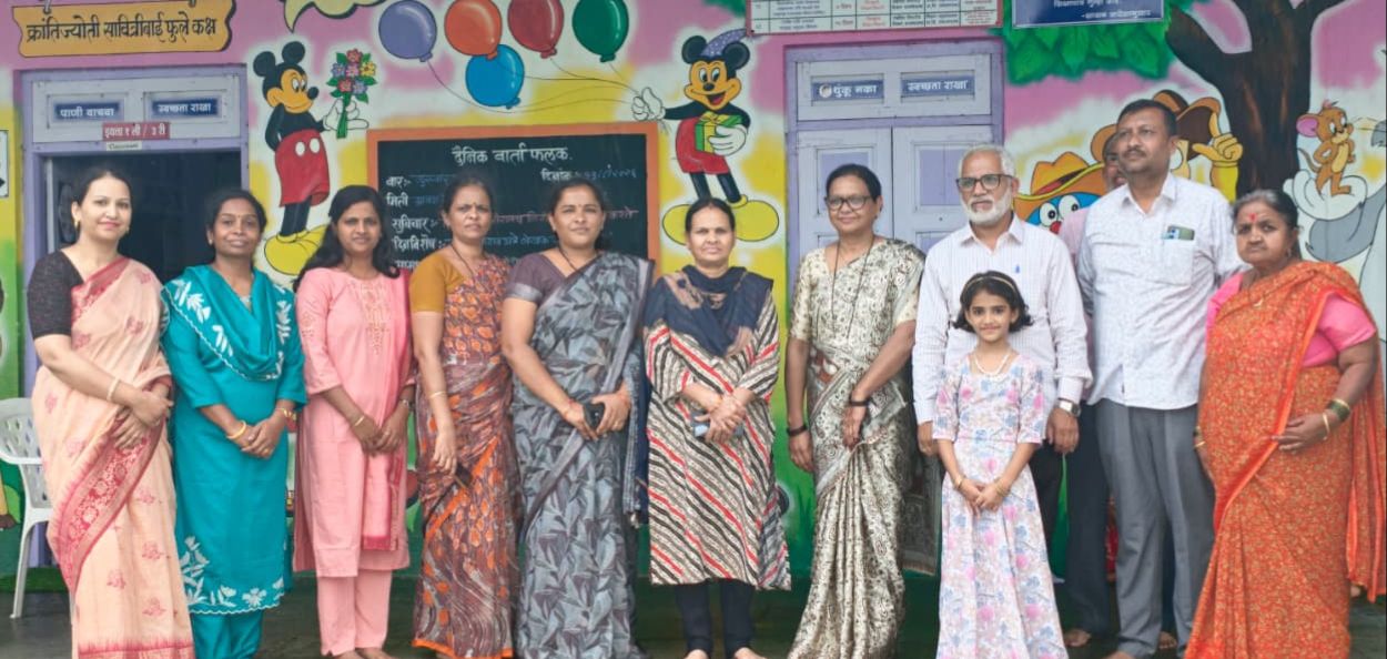 Aslam Sheikh with teachers and students of his village school