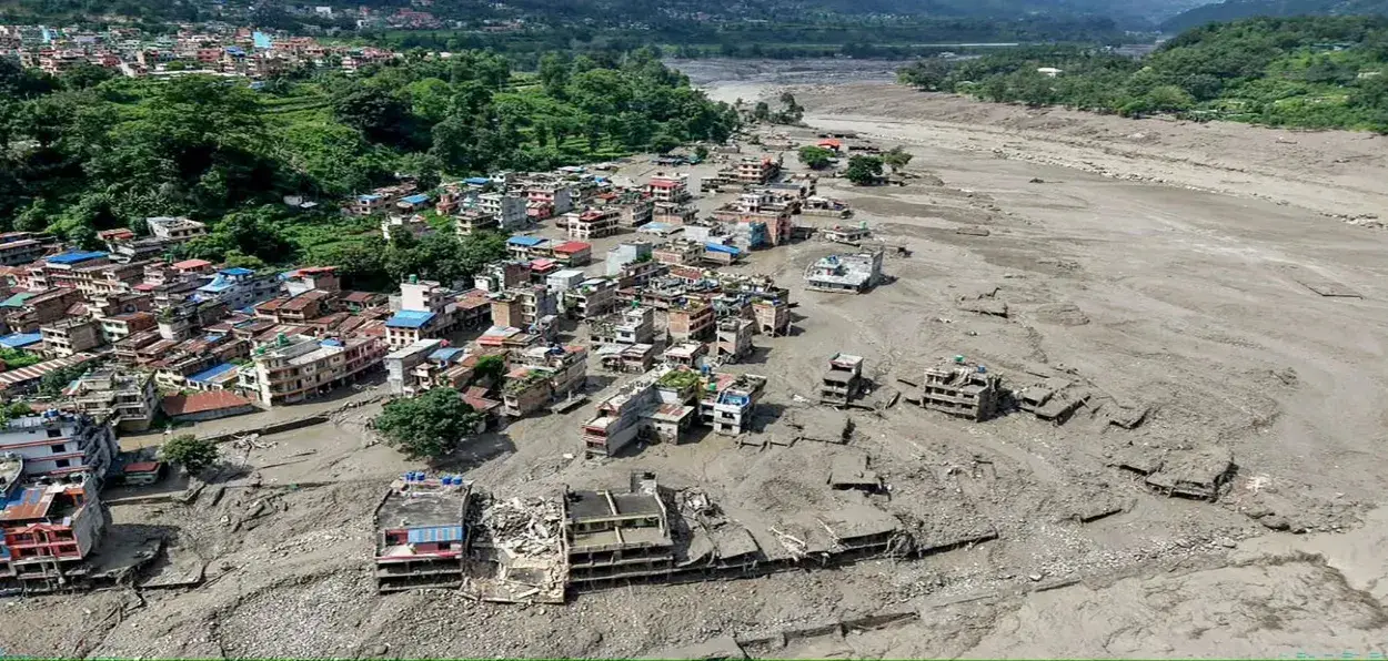 A scene of the mud covered Nepal village after the flash flood subsided
