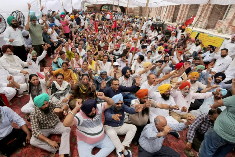 Punjab government employees and pensioners hold a statewide strike outside the Deputy Commissioner's office on August 27, 2026