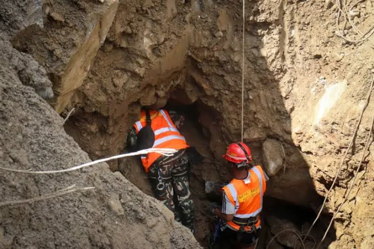 A Nepal army official during a rescue operation for the people trapped inside the tunnel of the Upper Trishuli 3 'A' Hydropower Project in Nuwakot, Nepal.
