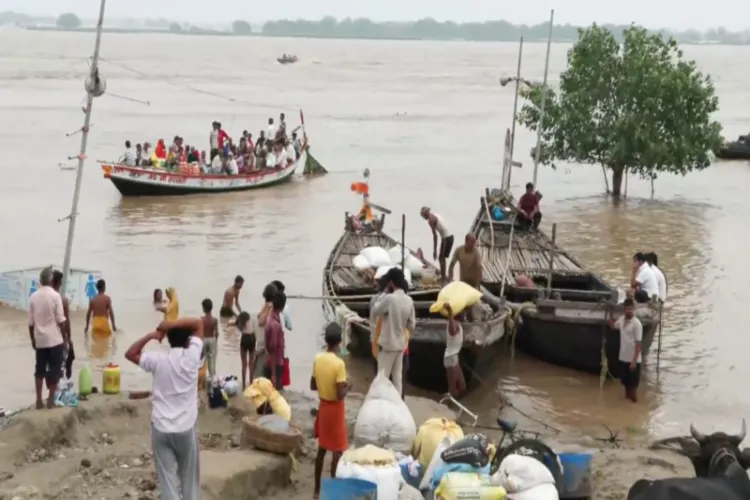 Residents of riverine areas move to safer locations as water levels in the Ganga and other rivers rise following flash floods in Nepal 