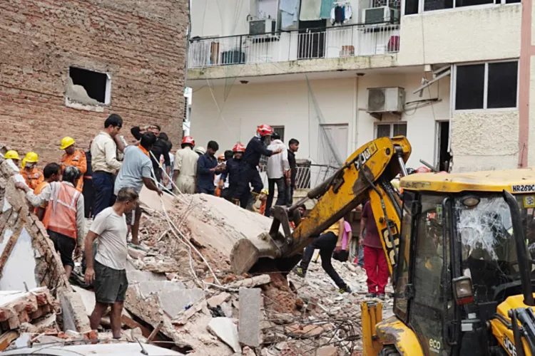 Rescue operations underway at the Satya Niketan building collapse site