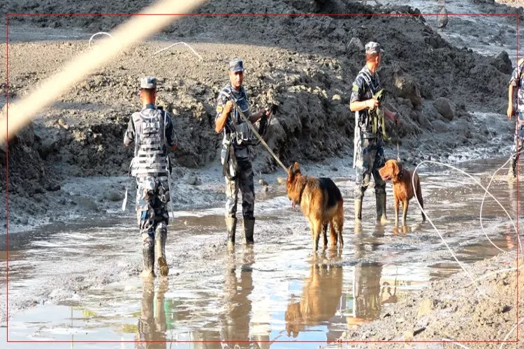 Nepal Police personnel conduct search and rescue operation following the devastating flash floods 