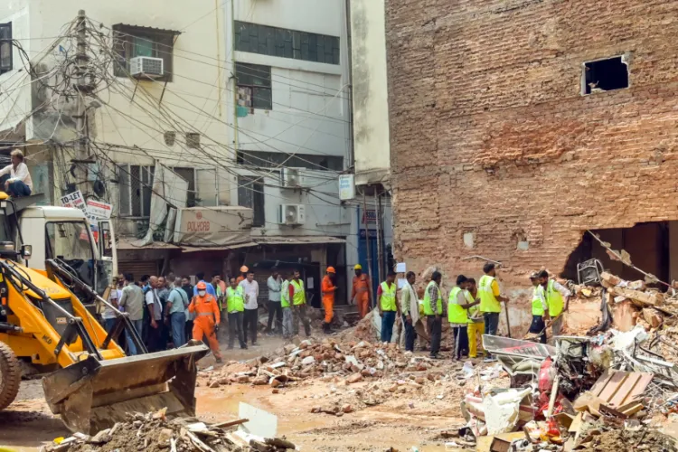 Visuals from the Satya Niketan building collapse site 
