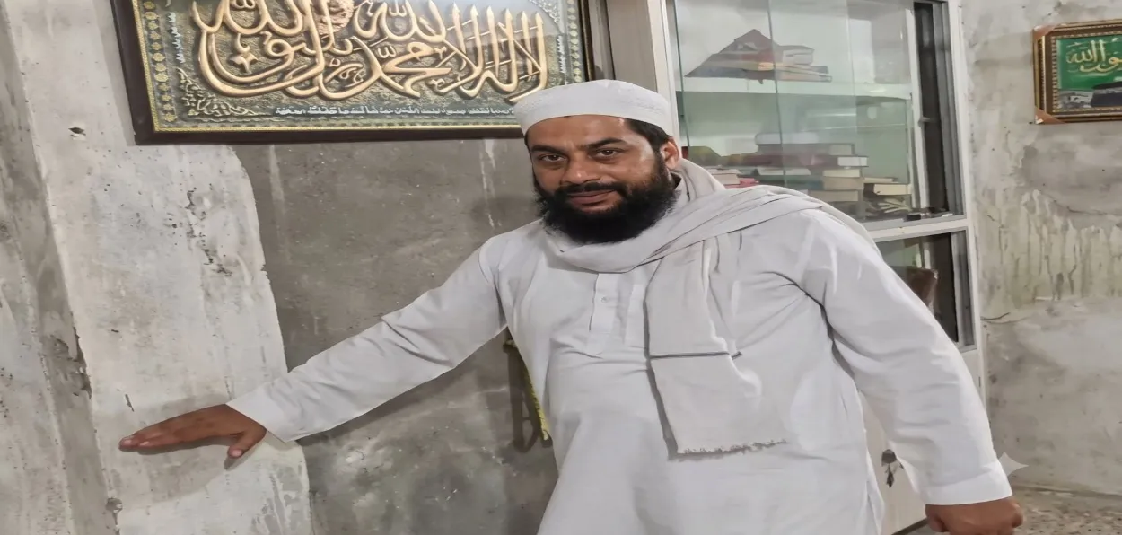 A Muslim inside the refurbished mosque