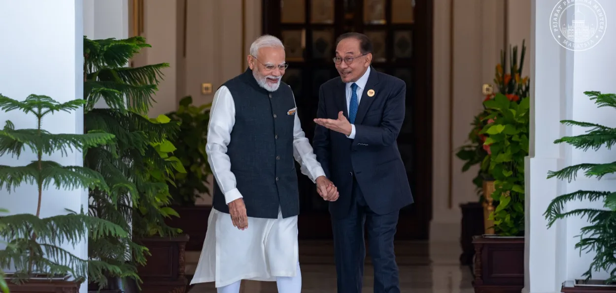 Malaysian Prime Minister Anwar Ibrahim sharing a lighter moment with Prime Minister Narendra Modi during the BRICS summit