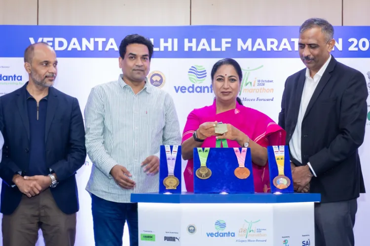 CM Rekha Gupta with the Vedanta Delhi Half Marathon 2026 Finisher's Medals