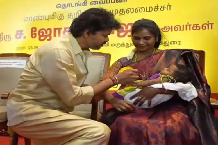 Tamil Nadu Chief Minister C. Joseph Vijay presents a Gold ring to a newborn child 