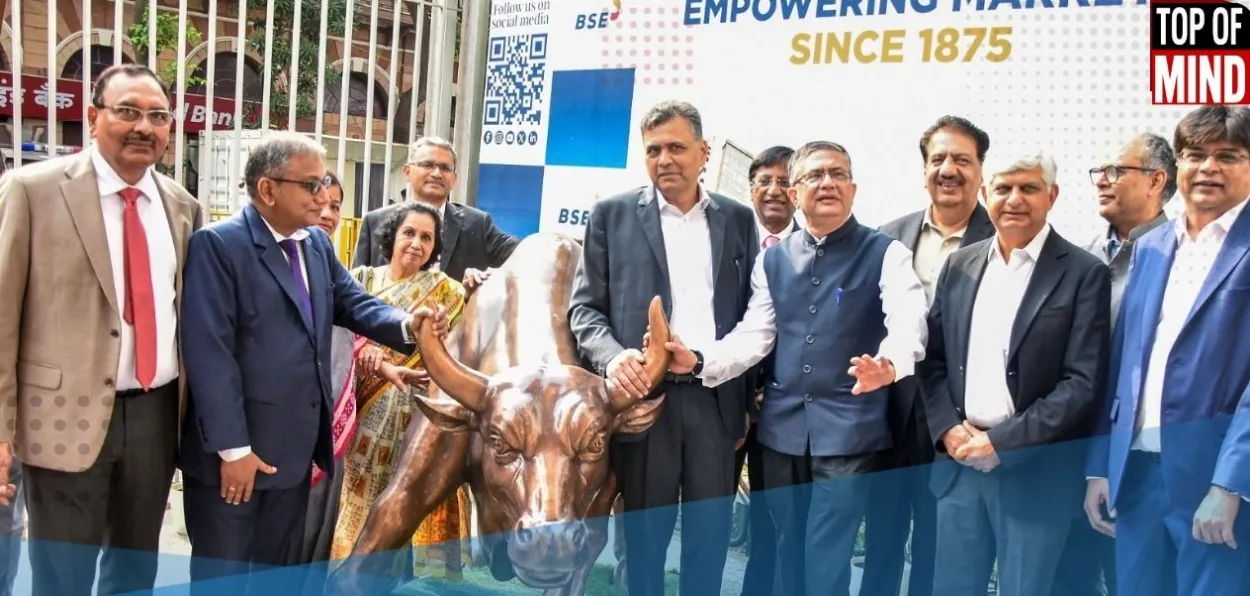  NSE Chairperson Srinivas Injeti and others pose for a photo with the 'Charging Bull' in Mumbai