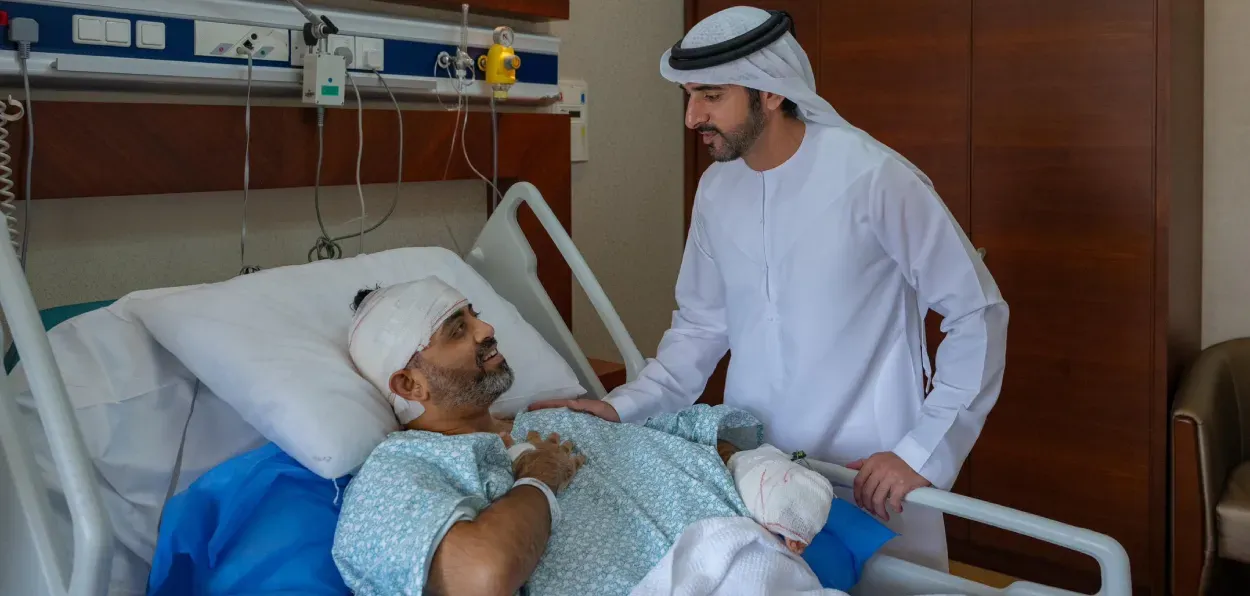 UAE Deputy PM Hamdan bin Mohammed with Flydubai pilot Captain Smit Machchhar in hospital 