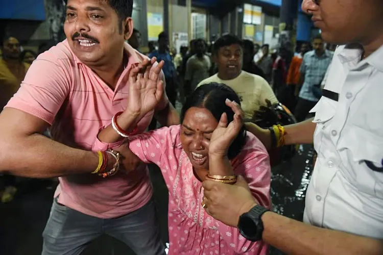 A woman breaks down at Kolkata Medical College, where those injured in the stampede at the Chorbagan Sarbojanin Durga Puja pandal have been brought for treatment, in Kolkata