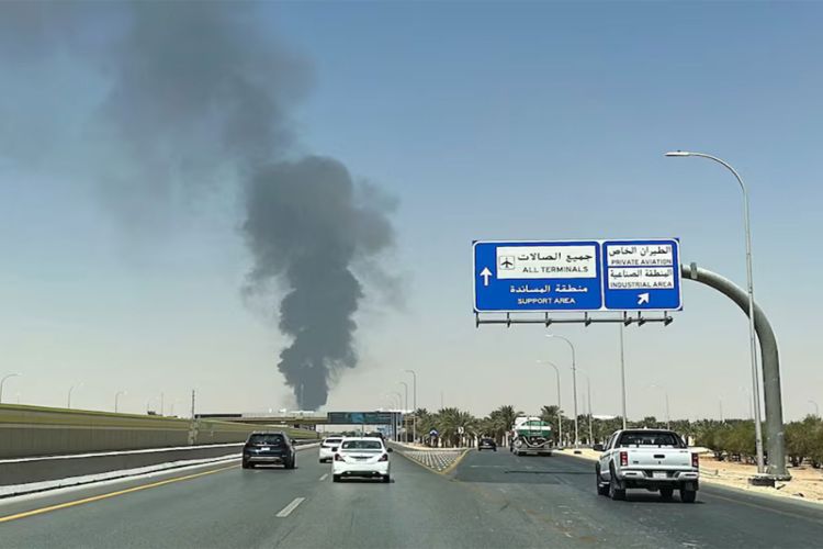 Large plume of black smoke rises from the fuel storage area at King Khalid International Airport, in Riyadh, Saudi Arabia. 