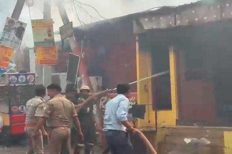 Fire tenders douse flames after a fire broke out in Noida's Sector 126
