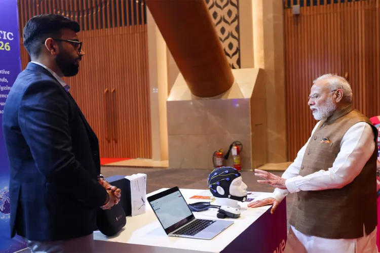 Prime Minister Narendra Modi visits a startup exhibition stall and interacts with an innovator