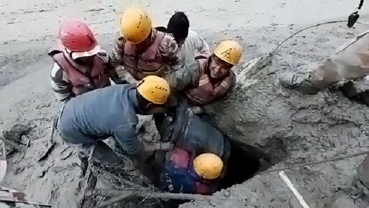 ITBP personnel rescuing men trapped in tunnel