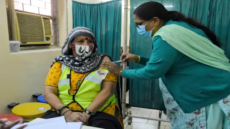 A frontline worker getting vaccinated in India  