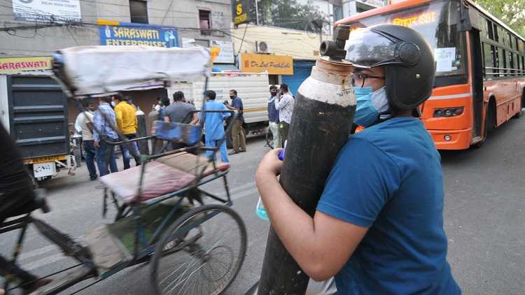 A relative of the Covid patient feels relieved to get oxygen gas cylinder at Dilshad Garden