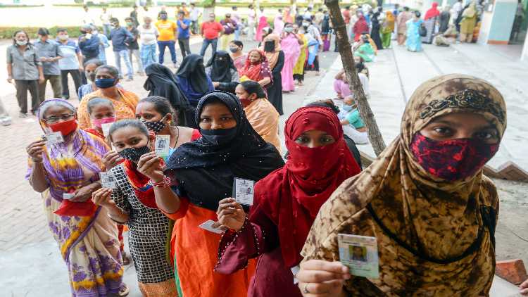 Voters waiting outside a polling booth in West Bengal