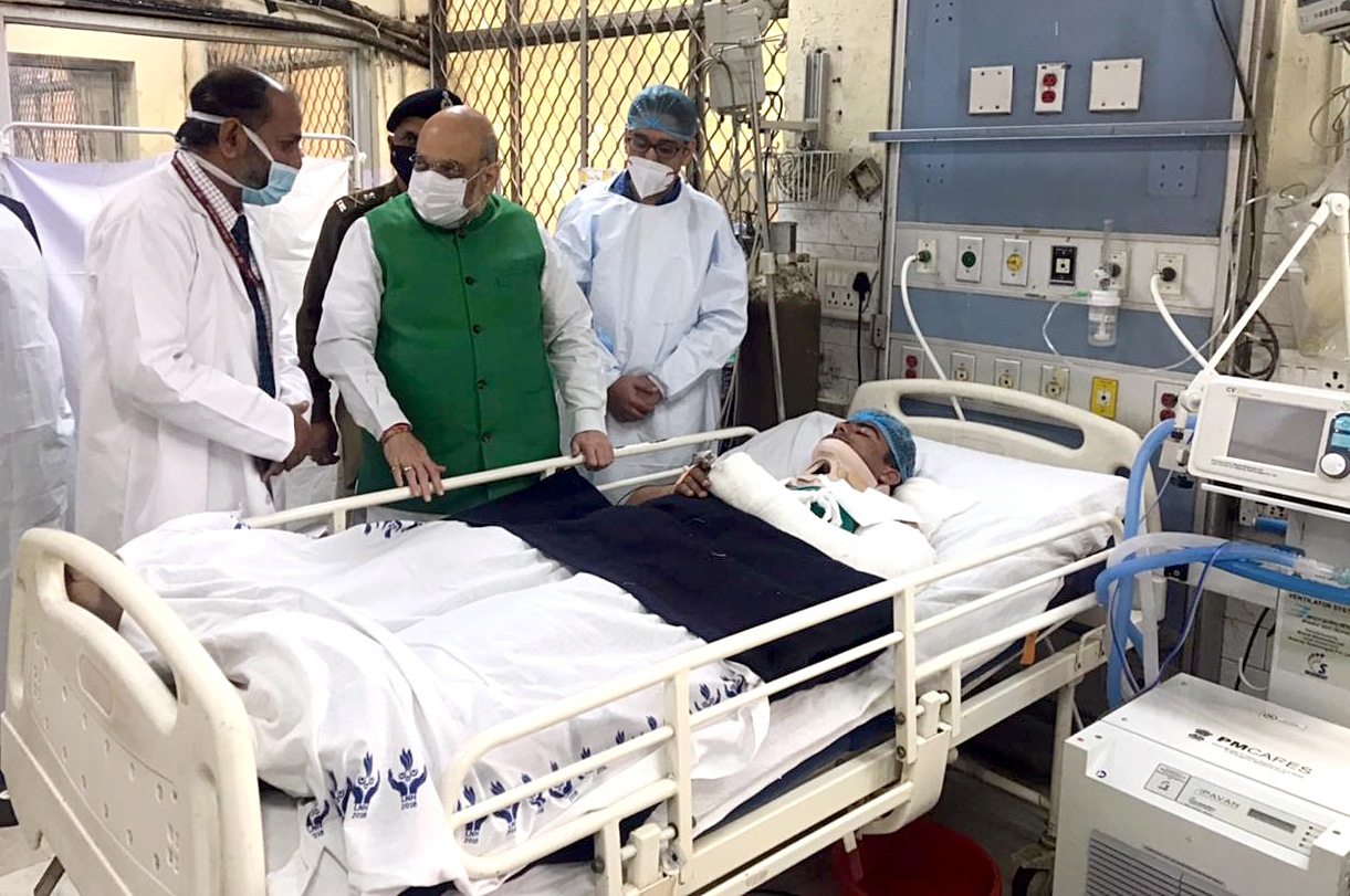 Union Home Minister Amit Shah meets Police personnel - injured in the violence during farmers' tractor rally on January 26th, at Sushruta Trauma Centre, Civil Lines in New Delhi on Thursday