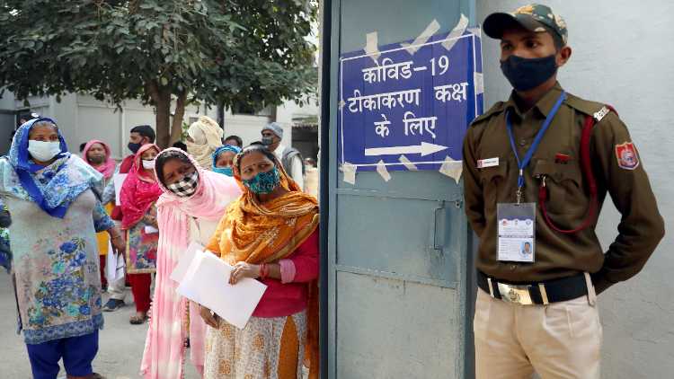 Frontline workers stand in queue to receive a Bharat Biotech COVID-19 vaccine called COVAXIN at Hindu Rao Hospital in New Delhi on Feb 16