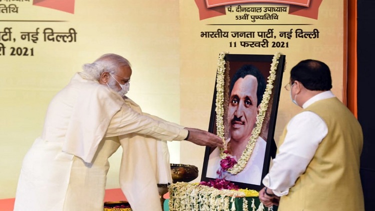 Prime Minister Narendra Modi pays floral tribute to Deen Dayal Upadhyay on Samarpan Day, in New Delhi on Thursday