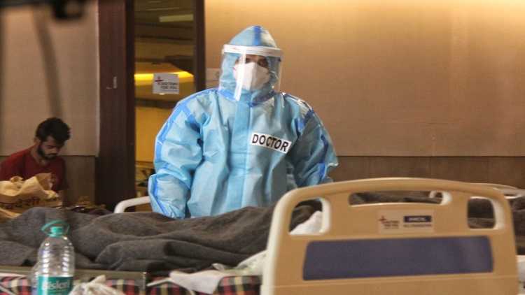 Health workers wearing PPE suits