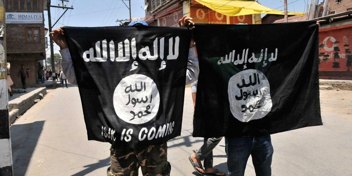 ISIS terrorists with propaganda banners 