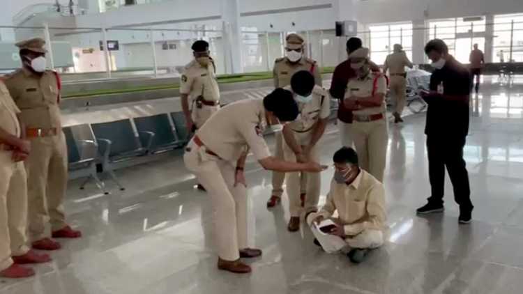 Naidu squatting at the Renigunta Airport near Tirupati