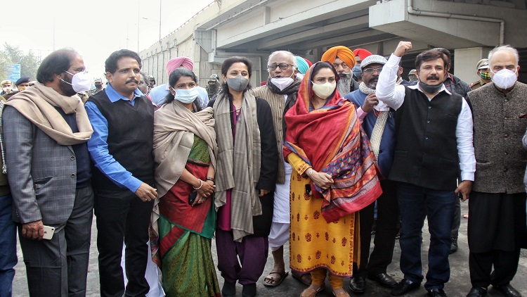 Opposition leaders -- NCP MP Supriya Sule, DMK MP Kanimozhi, SAD MP Harsimrat Kaur Badal and TMC MP Saugata Roy -- at Ghazipur border where farmers are protesting against farm laws in New Delhi on Thursday