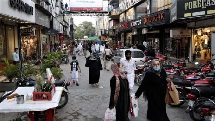 People walk at a market in eastern Pakistan's Rawalpindi