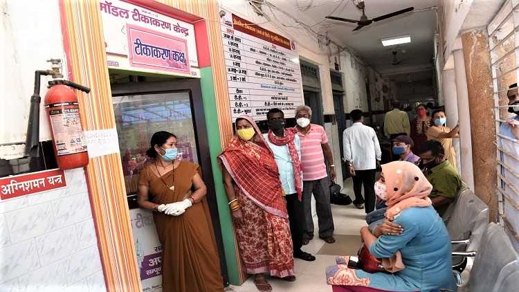 Beneficiaries receive the first dose of COVID-19 vaccine during the third phase of the countrywide inoculation drive in Patna on April 8