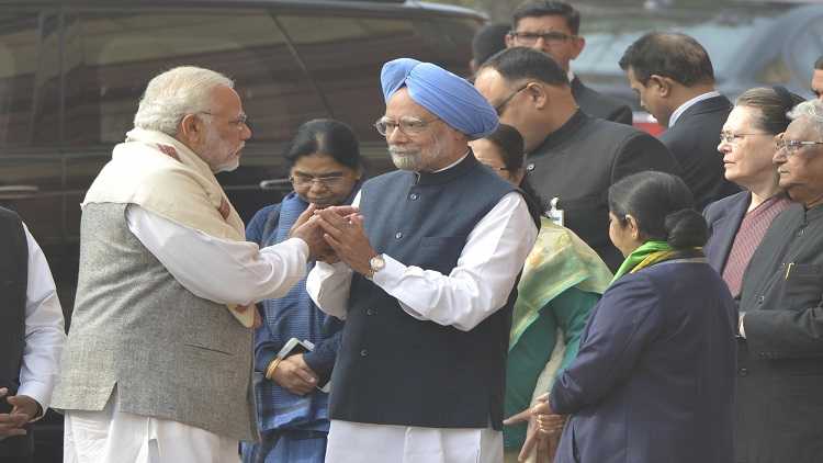 Prime Minister Narendra Modi greets his predecessor Manmohan Singh