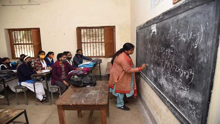 Students attend class after reopening of schools