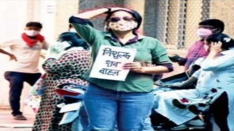 Varsha Verma holding a placard 