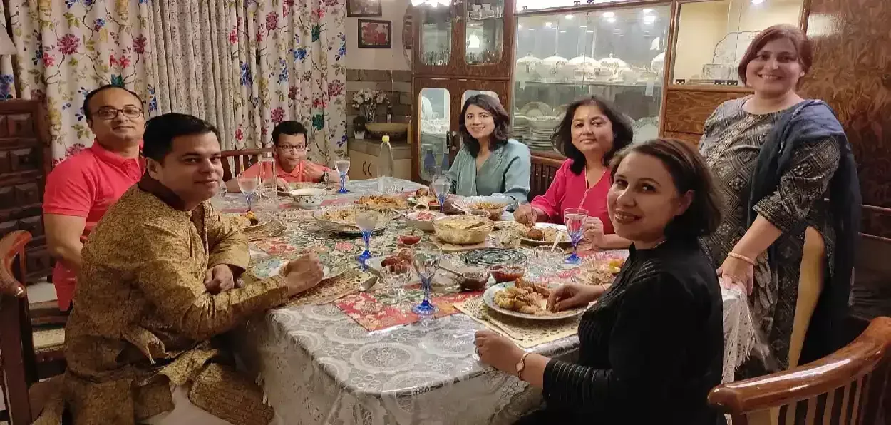 An Assamese Muslim family having meals on Eid